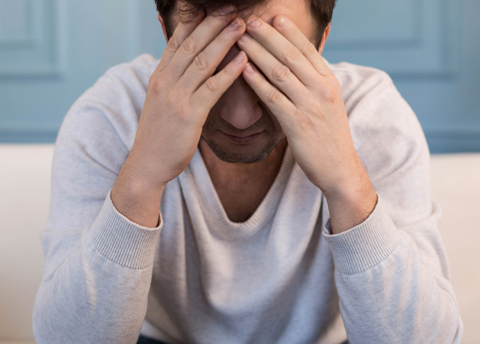 Sad Cheerless Man Covering His Face